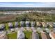 Row of homes with gray roofs and attached garages at 6299 Crested Eagle Ln, Nokomis, FL 34275