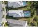 Home with gray roof and screened-in pool at 6299 Crested Eagle Ln, Nokomis, FL 34275