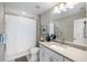 Clean bathroom with white vanity, shower, and toilet at 6299 Crested Eagle Ln, Nokomis, FL 34275