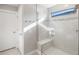 Modern bathroom with a walk-in shower and bench at 6299 Crested Eagle Ln, Nokomis, FL 34275