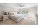 Comfortable bedroom with king-size bed and large windows at 6299 Crested Eagle Ln, Nokomis, FL 34275