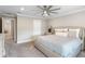 Primary bedroom with a large bed and ceiling fan at 6299 Crested Eagle Ln, Nokomis, FL 34275