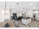 Kitchen and dining area with open concept and wood floors at 6299 Crested Eagle Ln, Nokomis, FL 34275