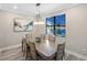 Bright dining room with large table and chandelier at 6299 Crested Eagle Ln, Nokomis, FL 34275