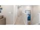 Bright hallway with neutral walls and carpet at 6299 Crested Eagle Ln, Nokomis, FL 34275