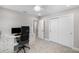 Home office with a desk, chair, and view into another room at 6299 Crested Eagle Ln, Nokomis, FL 34275