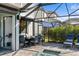 Covered patio with dining table and chairs near the pool at 6299 Crested Eagle Ln, Nokomis, FL 34275