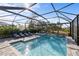 Relax in this screened pool and spa area at 6299 Crested Eagle Ln, Nokomis, FL 34275