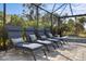 Four chaise lounges provide ample space for relaxing by the pool at 6299 Crested Eagle Ln, Nokomis, FL 34275