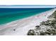 Aerial view of a pristine beach with turquoise water at 630 Companion Way, Longboat Key, FL 34228