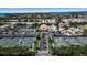 Aerial view of community with tennis courts and pool at 630 Companion Way, Longboat Key, FL 34228