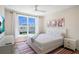 Bright bedroom with a queen bed and large window at 630 Companion Way, Longboat Key, FL 34228