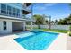 Large pool and spa with a patio and house view at 630 Companion Way, Longboat Key, FL 34228