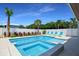 Inviting pool and spa with lounge chairs at 630 Companion Way, Longboat Key, FL 34228