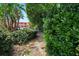 Landscaped walkway leading to residential building at 630 Companion Way, Longboat Key, FL 34228