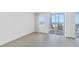 Bright bedroom with tile floors and balcony access with ocean view at 6300 Midnight Pass Rd # 810, Sarasota, FL 34242