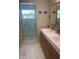 Modern bathroom, featuring double vanity and walk-in shower at 633 Avenida De Mayo, Sarasota, FL 34242