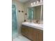 Elegant bathroom with double vanity and a walk-in shower at 633 Avenida De Mayo, Sarasota, FL 34242