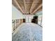 Room under renovation with exposed ceiling beams and new flooring at 633 Avenida De Mayo, Sarasota, FL 34242