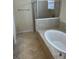 Bathroom boasts a large garden tub and glass shower at 6442 Willowshire Way, Bradenton, FL 34212