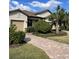 Single-story house featuring a two-car garage and manicured landscaping at 6442 Willowshire Way, Bradenton, FL 34212