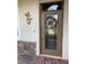 Inviting front entrance with a decorative seashell wreath at 6442 Willowshire Way, Bradenton, FL 34212