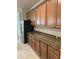 Kitchen with wood cabinets and granite countertops at 6442 Willowshire Way, Bradenton, FL 34212