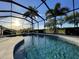 Inviting screened-in pool and spa area with beautiful sunset views at 6442 Willowshire Way, Bradenton, FL 34212