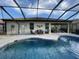 Inviting pool and spa with a covered patio and seating area at 6442 Willowshire Way, Bradenton, FL 34212