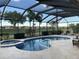 Relaxing screened-in pool and spa with a golf course view at 6442 Willowshire Way, Bradenton, FL 34212