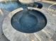 Private spa with a circular design and tile accents at 6442 Willowshire Way, Bradenton, FL 34212