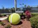 River Strand Tennis Center sign with large tennis ball at 6442 Willowshire Way, Bradenton, FL 34212