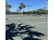 Well-maintained tennis courts with seating area at 6442 Willowshire Way, Bradenton, FL 34212