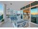 Enjoy sunset views from this expansive balcony, which overlooks the ocean and includes comfortable seating and access to the interior at 655 Longboat Club Rd # 14A, Longboat Key, FL 34228