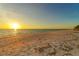 Stunning sunset view over the ocean and beach at 655 Longboat Club Rd # 14A, Longboat Key, FL 34228