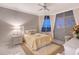 Cozy bedroom with golf course view, and a ceiling fan at 655 Longboat Club Rd # 14A, Longboat Key, FL 34228