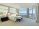 Serene main bedroom with ocean views and private balcony access at 655 Longboat Club Rd # 14A, Longboat Key, FL 34228