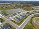 Aerial view of a new residential community with a lake at 6708 162Nd E Pl, Parrish, FL 34219