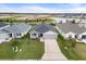 Aerial view of three similar homes with attached garages and front yards at 6708 162Nd E Pl, Parrish, FL 34219