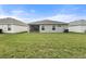 View of the house's back elevation and the expansive lawn at 6708 162Nd E Pl, Parrish, FL 34219