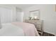 Serene bedroom with a blush-colored quilt and dresser at 6708 162Nd E Pl, Parrish, FL 34219