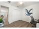 Bright home office with wood-look floors and a view to dining area at 6708 162Nd E Pl, Parrish, FL 34219