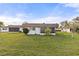 House exterior view, single story home with lawn at 680 Circlewood Dr # W3, Venice, FL 34293