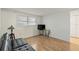 Bright guest bedroom with wood floors and large window at 680 Circlewood Dr # W3, Venice, FL 34293