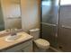 Bathroom features a toilet, sink, and shower at 7092 W Country Club N Dr, Sarasota, FL 34243