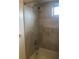 Bathroom with shower/tub combo and tile surround at 7092 W Country Club N Dr, Sarasota, FL 34243