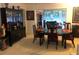 Dining room with a dark wood table and access to the living room at 7092 W Country Club N Dr, Sarasota, FL 34243