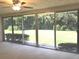 Living room with large sliding glass doors and view of backyard at 7092 W Country Club N Dr, Sarasota, FL 34243