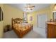 Charming bedroom with a queen-size bed and neutral color palette at 790 Shadow Bay Way, Osprey, FL 34229