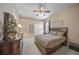 Comfortable guest bedroom with a king-size bed and ample closet space at 790 Shadow Bay Way, Osprey, FL 34229